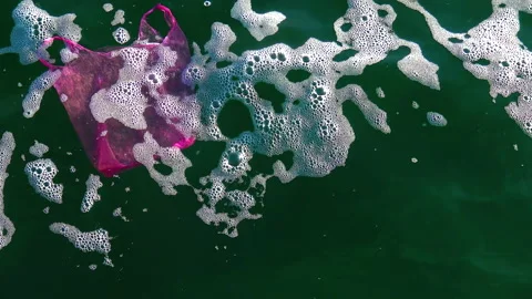 Garbage plastic bag on the sea beats with a wave, ecology Stock Footage 229894119