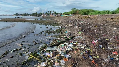 Garbage plastic beach sea waste Cebu landfill ocean pollution bottles coast Stock Footage 324898867