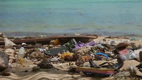 Garbage, plastic bottles and rubbish dumped at the beach. Stock Footage 107441198