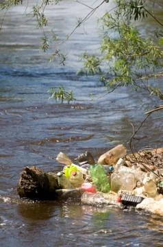 Garbage plastic bottles damage river after flood Stock Photos