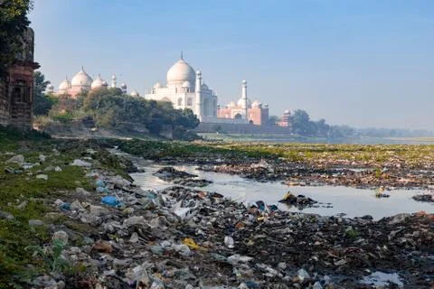 Garbage in polluted Yamuna river by the most beautiful Taj Mahal Stock Photos