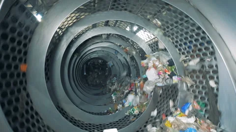 Garbage recycling machine during working process. Garbage sorting plant. Stock Footage 93787231