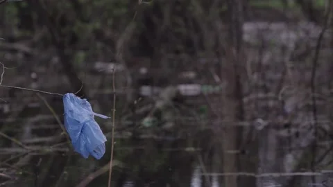 Garbage in the reservoir bottles plastic Stock Footage 145770954
