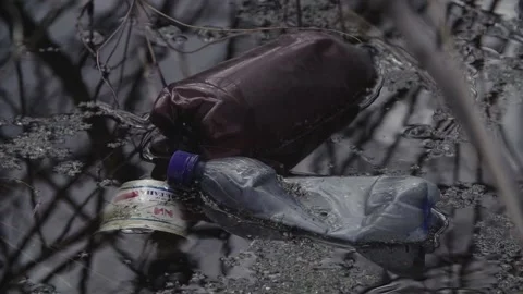 Garbage in the reservoir bottles plastic Video stock 145771020