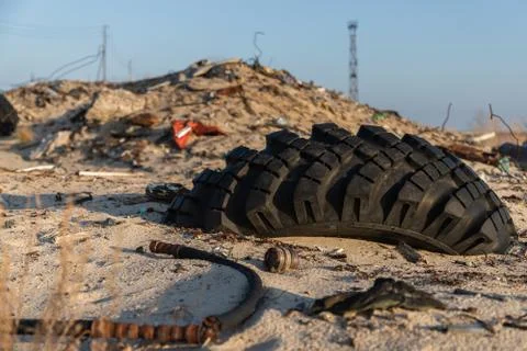 Garbage on the river. Dump. Environmental disaster. Rubber in the ground. 스톡 사진