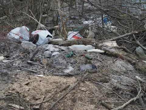 Garbage on the riverside Stock Photos