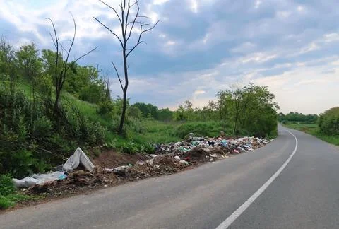 Garbage by the roadside in nature Stock Photos