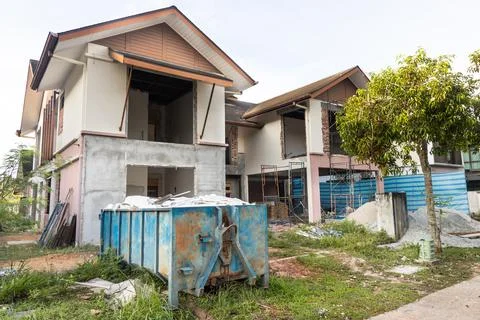 Garbage roro dumpter bin collects rubbish at construction site Stock Photos