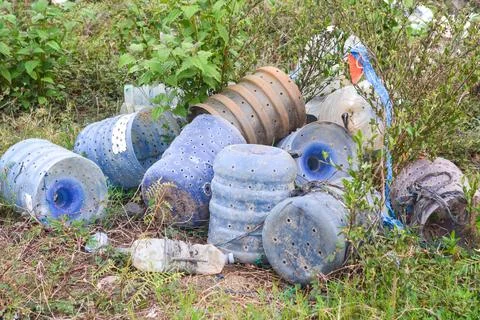 Garbage scattered on the edge of the lake Stock Photos