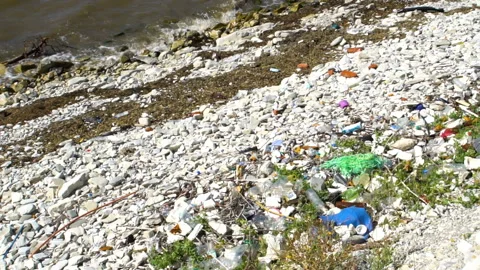 Garbage by the sea Video stock 137925094