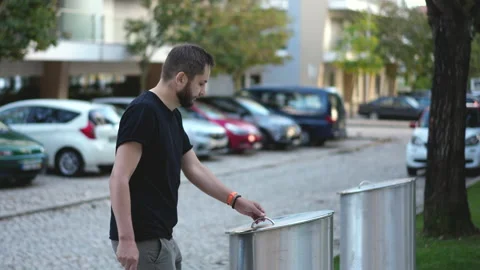 Garbage separating for recycling bins on city streets. Organic wastes disposing. Stock Footage 165257247