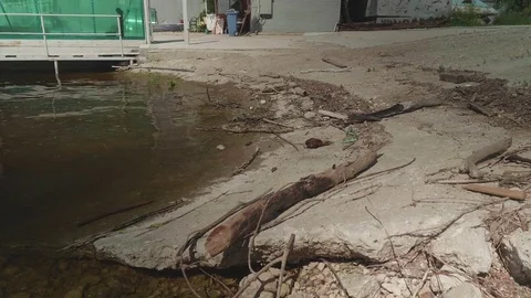 Garbage on shore of river in marina. Stock Footage 77658875