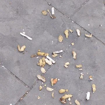 Garbage on the side of the road that has not been swept away Stock Photos
