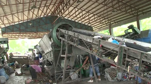 Garbage sorting machine with trash on conveyor belt in Philippines Stock Footage 48334541