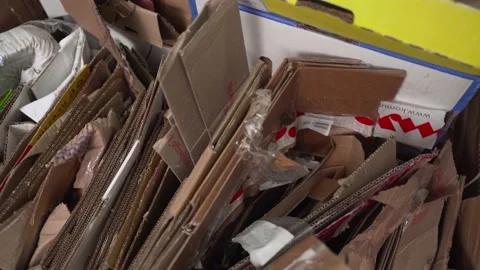 Garbage from stacks of cardboard for recycling. Stock Footage 168076321