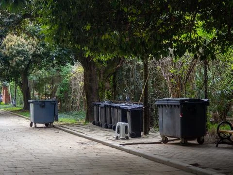 Garbage storage area. Lots of trash cans. Stock Photos