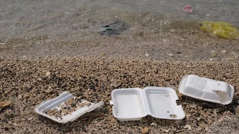 Garbage trash styrofoam being washed to the shore Stock Footage 300067047