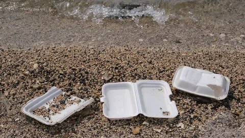 Garbage trash styrofoam being washed to the shore Stock Footage 300067090