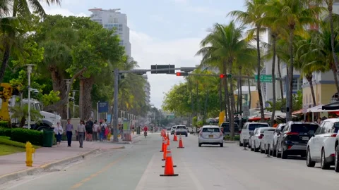 Garbage truck driving through Ocean Drive and 10th Street Miami Beach Flori.. Stock Footage 299614444