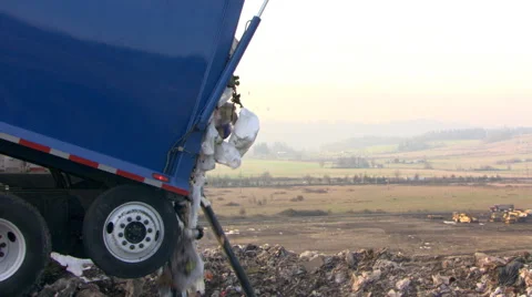 Garbage truck dumping at landfill Stock Footage 59513060