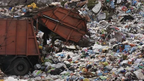 Garbage truck dumps unsorted garbage. Damage to the environment. Stock Footage 173058428