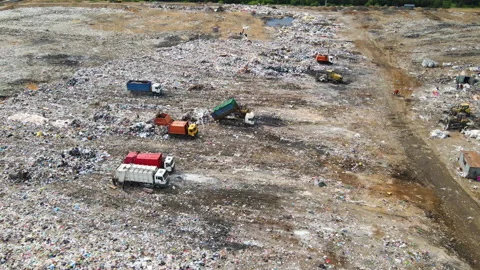 Garbage truck during unloading rubbish and food waste on landfill. 動画素材 156600142