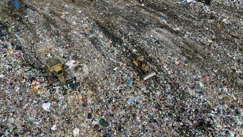 Garbage truck during unloading rubbish and food waste on landfill. 스톡 동영상 156606911