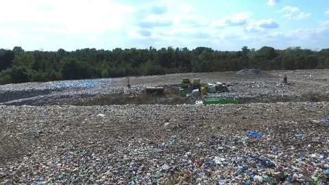 The garbage truck goes between the top of the garbage, aerial view Stock Footage 85290879