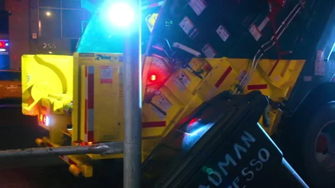 Garbage truck lifting waste container on Manhattan street Stock Footage 342330689