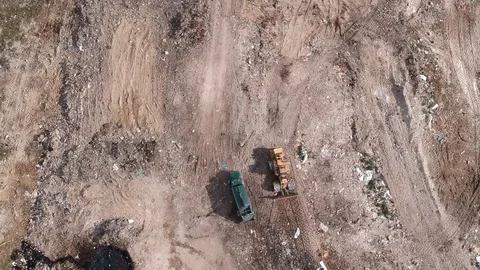 Garbage Truck Offloading Waste at Freeport Landfill, Bahamas Aerial Stock Footage 88916786