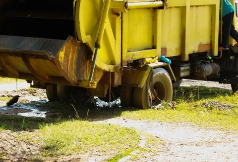 Garbage truck stuck in the mud Stock Photos