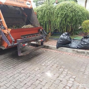 Garbage truck to take to the waste processing site Stock Photos