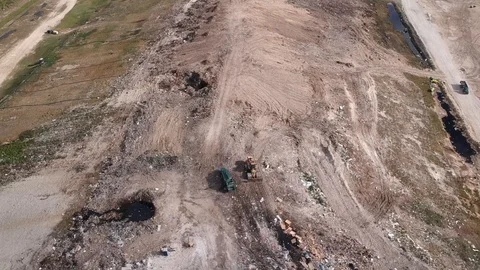 Garbage Truck Unloading at Freeport Dump Yard, Bahamas Drone View Stock Footage 88916698