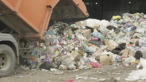 A garbage truck unloads garbage Stock Footage 306789734