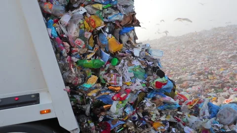 A garbage truck unloads garbage at one of the landfills. Stock Footage 231246618