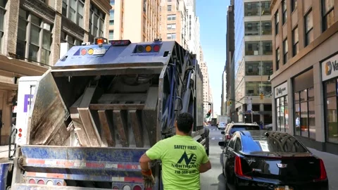 Garbage Trucks and Crews Working in Manhattan Video stock 130966034