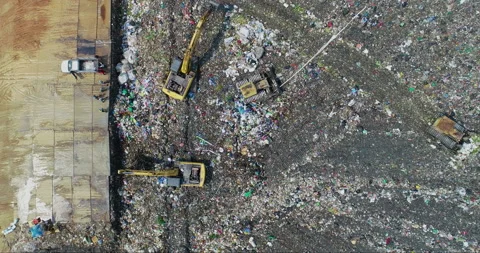 Garbage trucks are working in the waste sorting plant. Stock Footage 156404335