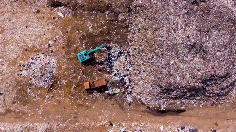 Garbage trucks dump garbage landfill. Time lapse Aerial view. Video stock 218376436