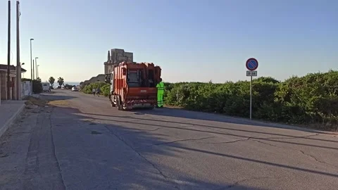 Garbage trucks with garbage collectors do door-to-door Stock Footage 141128914
