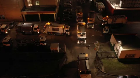 Garbage trucks leave the waste processing plant Stockbeeldmateriaal 129639231