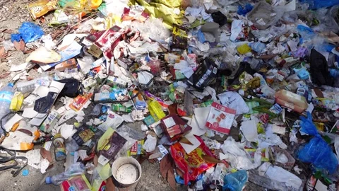 Garbage was thrown away not in the proper garbage disposal site, in an empt.. Stock Footage 300989648