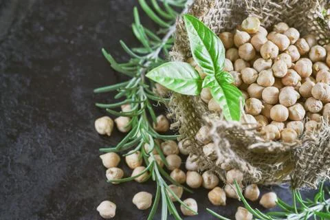 Garbanzo beans on dark rustic background Stock Photos