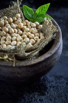 Garbanzo beans on dark rustic background Stock Photos