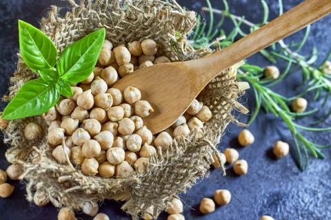 Garbanzo beans on dark rustic background Stock Photos