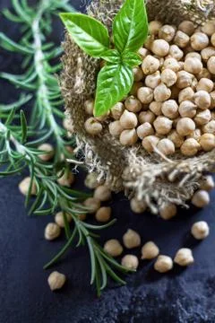 Garbanzo beans on dark rustic background Stock Photos