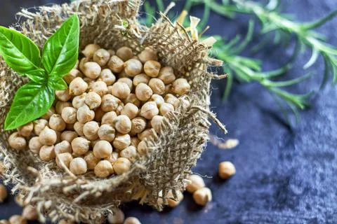 Garbanzo beans on dark rustic background Stock Photos