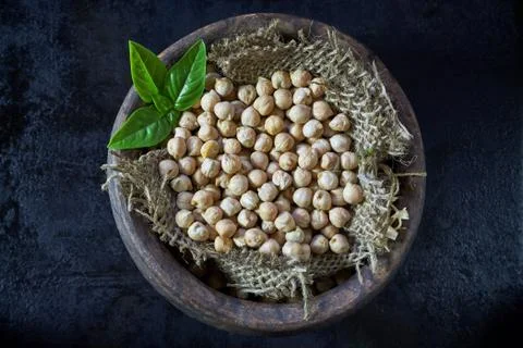Garbanzo beans on dark rustic background Stock Photos