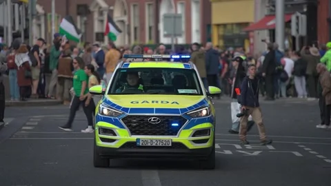 Garda car on O'Connell Street during an anti-Trump protest - September 2026 Stock Footage 346256945