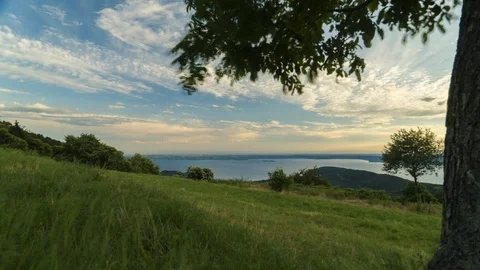 Garda Lake view with trees and wind, Veneto, time lapse with dolly left Stock Footage 88550136