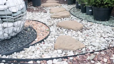 Garden center. Landscape design. A path lined with multicolored stones. Stock Footage 221310247